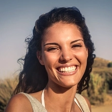 Happy latina woman smiling outside