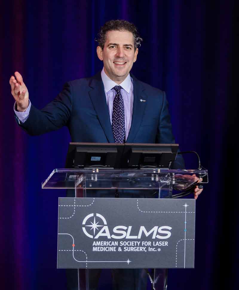 dr. friedman on stage at convention